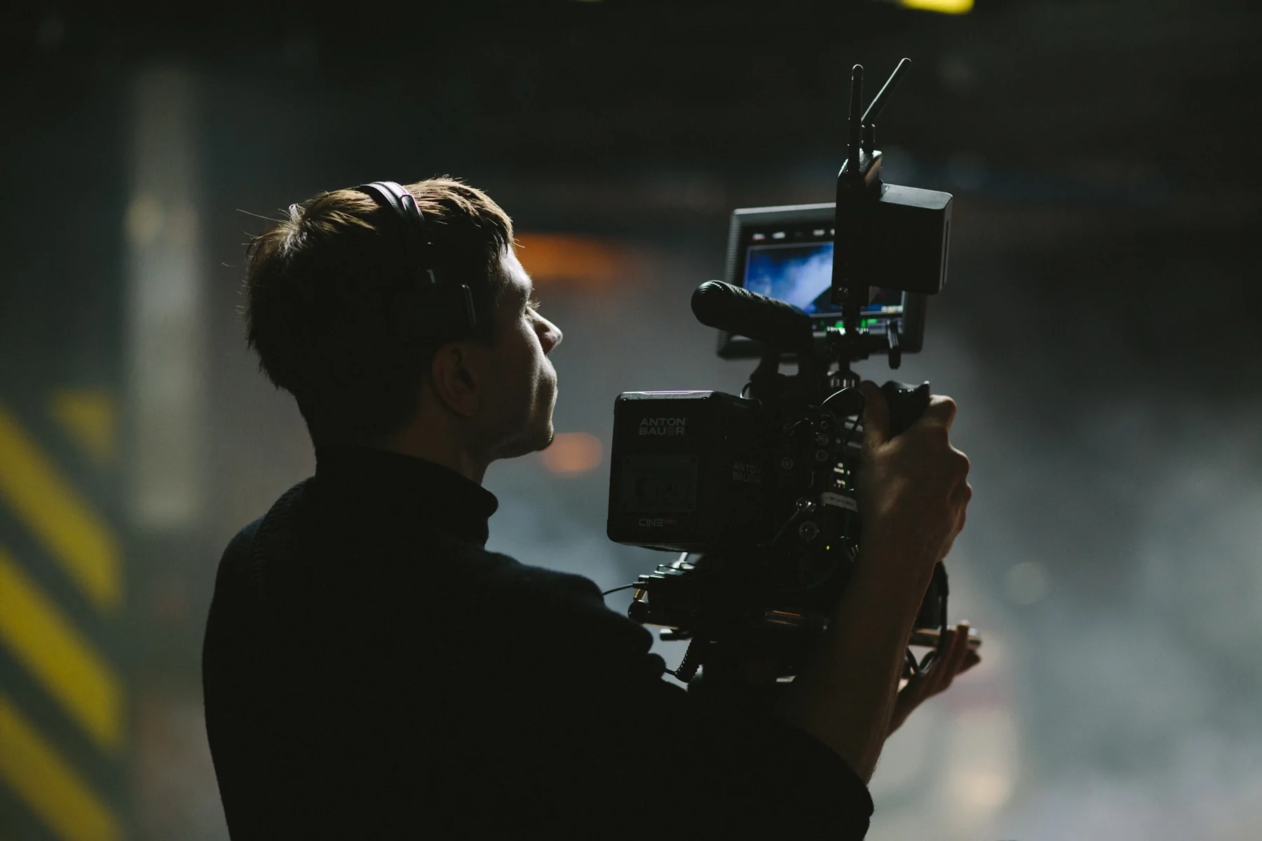 Camera operator filming on set